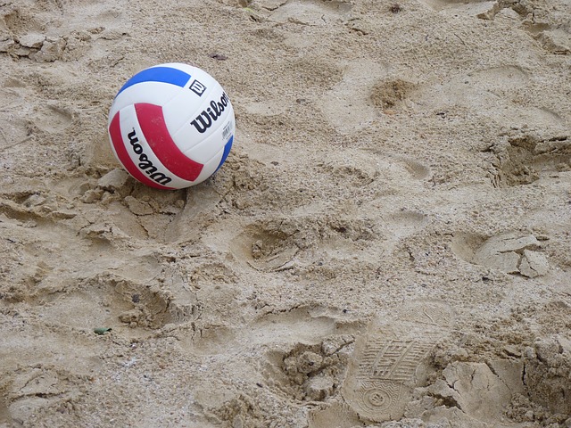 a ball on beach sand